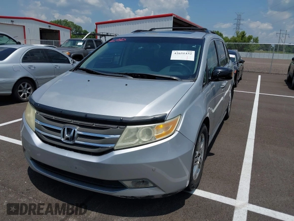 2011 Honda Odyssey Touring with VIN 5FNRL5H99BB058448, listed as a IAAI auction lot 42651432 with 208,581 mi miles and . Bid and sale history available at DreamBid. Image 2.