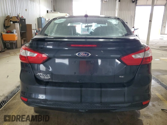 2013 Ford Focus SE with VIN 1FADP3F21DL348827, listed as a Copart auction lot 63589405 with 144,156 mi miles and Salvage title. Bid and sale history available at DreamBid. Image 6.