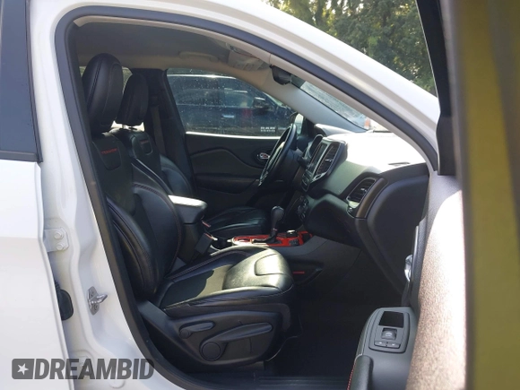 2021 Jeep Cherokee Trailhawk with VIN 1C4PJMBX4MD124980, listed as a IAAI auction lot 42372537 with 55,667 mi miles and . Bid and sale history available at DreamBid. Image 5.