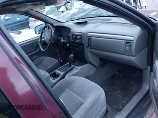 2001 Jeep Grand Cherokee Laredo z VIN 1J4GX48S41C585151, wystawiony jako IAAI lot #41020660 z przebiegiem Nie podano mil oraz . Historia ofert i sprzedaży dostępna na DreamBid. Obrazek 5.