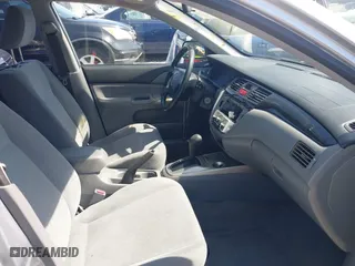 2004 Mitsubishi Lancer ES with VIN JA3AJ26E54U052124, listed as a IAAI auction lot 41804473 with 165,786 mi miles. Bid and sale history available at carsss.com. Image 5.