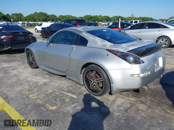 2003 Nissan 350Z Touring z VIN JN1AZ34E23T019866, wystawiony jako IAAI lot #41293510 z przebiegiem 118 416 mil mil oraz . Historia ofert i sprzedaży dostępna na DreamBid. Obrazek 3.