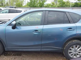 2016 Mazda CX-5 Touring z VIN JM3KE2CY3G0728968, wystawiony jako IAAI lot #42189174 z przebiegiem 145 977 mil mil oraz . Historia ofert i sprzedaży dostępna na DreamBid. Obrazek 15.
