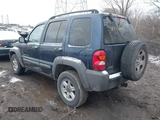 2002 Jeep Liberty Sport with VIN 1J8GL48K32W132617, listed as a IAAI auction lot 41732799 with 202,894 mi miles. Bid and sale history available at carsss.com. Image 3.