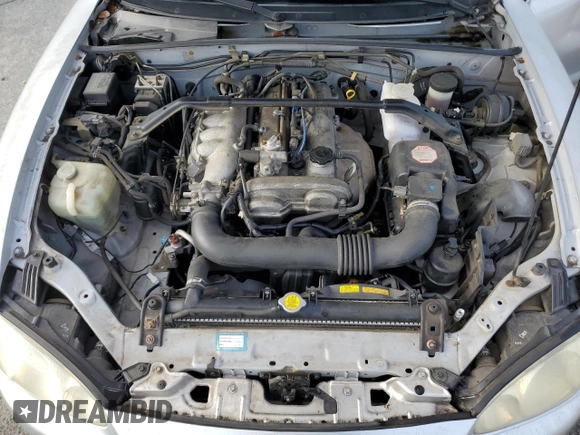 2003 Mazda MX-5 Miata Cloth z VIN JM1NB353630305964, wystawiony jako Copart lot #58517505 z przebiegiem 129 675 mil mil oraz Szkoda całkowita • Salvage title. Historia ofert i sprzedaży dostępna na DreamBid. Obrazek 11.