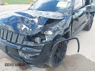2021 Jeep Grand Cherokee Laredo X with VIN 1C4RJFAG2MC516111, listed as a IAAI auction lot 42222439 with 60,888 mi miles and . Bid and sale history available at DreamBid. Image 6.