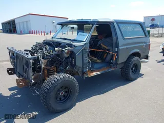1988 Ford Bronco XL with VIN 1FMEU15N3JLA69197, listed as a IAAI auction lot 42082657 with 287,213 mi miles. Bid and sale history available at carsss.com. Image 2.