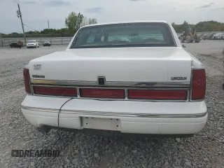 1997 Lincoln Town Car Signature z VIN 1LNLM82W2VY697709, wystawiony jako Copart lot #70506934 z przebiegiem 200 288 mil mil oraz Szkody całkowita. Historia ofert i sprzedaży dostępna na DreamBid. Obrazek 6.