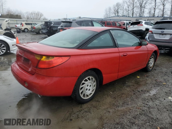 2002 Saturn SC z VIN 1G8ZY12752Z308435, wystawiony jako Copart lot #85364214 z przebiegiem 112 649 mil mil oraz Tytuł czysty. Historia ofert i sprzedaży dostępna na DreamBid. Obrazek 3.