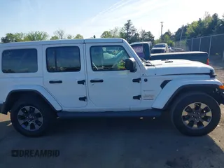 2018 Jeep Wrangler Unlimited Sahara z VIN 1C4HJXEG9JW227829, wystawiony jako IAAI lot #42099356 z przebiegiem 130 259 mil mil oraz . Historia ofert i sprzedaży dostępna na DreamBid. Obrazek 13.