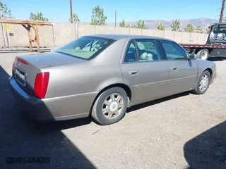 2003 Cadillac DeVille with VIN 1G6KD54Y43U136688, listed as a IAAI auction lot 41860719 with 124,230 mi miles. Bid and sale history available at carsss.com. Image 4.