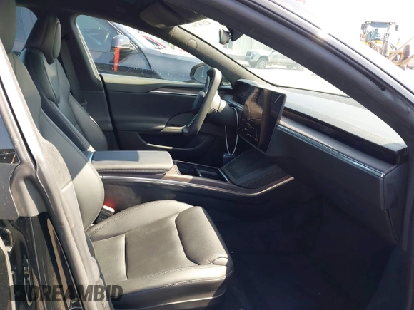 2022 Tesla Model S with VIN 5YJSA1E5XNF467435, listed as a IAAI auction lot 42538706 with 26,504 mi miles and . Bid and sale history available at DreamBid. Image 5.