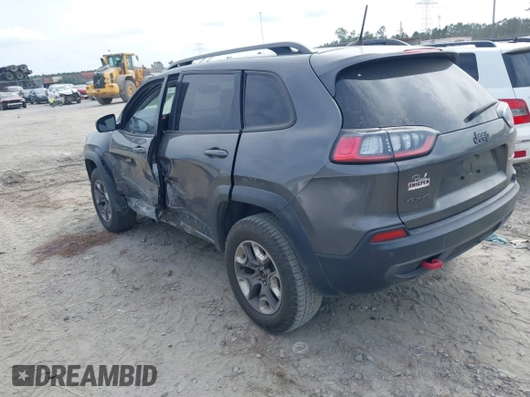 2019 Jeep Cherokee Trailhawk z VIN 1C4PJMBX1KD314121, wystawiony jako IAAI lot #42106721 z przebiegiem 105 631 mil mil oraz . Historia ofert i sprzedaży dostępna na DreamBid. Obrazek 3.