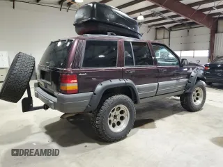 1996 Jeep Grand Cherokee Laredo with VIN 1J4GZ58Y1TC171915, listed as a Copart auction lot 50764034 with 0 mi miles and Salvage Title. Bid and sale history available at carsss.com. Image 3.