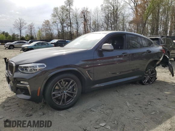 2019 BMW X4 M40i with VIN 5UXUJ5C5XKLJ64004, listed as a Copart auction lot 52106895 with 74,599 mi miles and Salvage title. Bid and sale history available at DreamBid. Image 1.