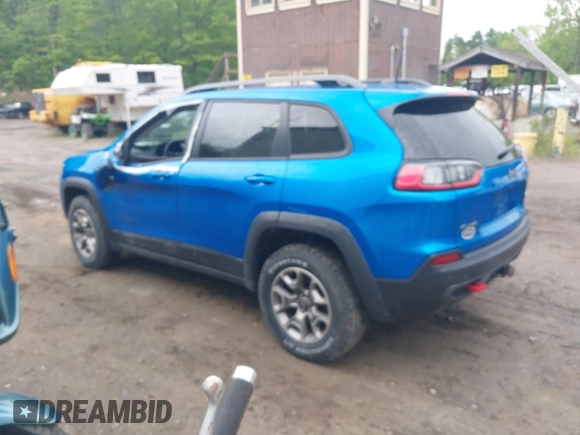 2021 Jeep Cherokee Trailhawk with VIN 1C4PJMBXXMD173102, listed as a IAAI auction lot 42205402 with 57,321 mi miles and . Bid and sale history available at DreamBid. Image 3.