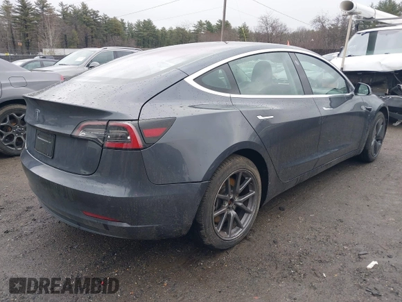 2019 Tesla Model 3 Mid Range with VIN 5YJ3E1EA3KF307415, listed as a IAAI auction lot 41673239 with 42,895 mi miles and . Bid and sale history available at DreamBid. Image 4.