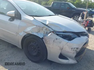 2018 Toyota Corolla L with VIN 2T1BURHE6JC100175, listed as a IAAI auction lot 42405737 with 123,183 mi miles and . Bid and sale history available at DreamBid. Image 6.