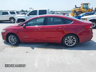 2019 Ford Fusion Hybrid SE with VIN 3FA6P0LU6KR243678, listed as a IAAI auction lot 40004890 with 138,533 mi miles. Bid and sale history available at carsss.com. Image 14.