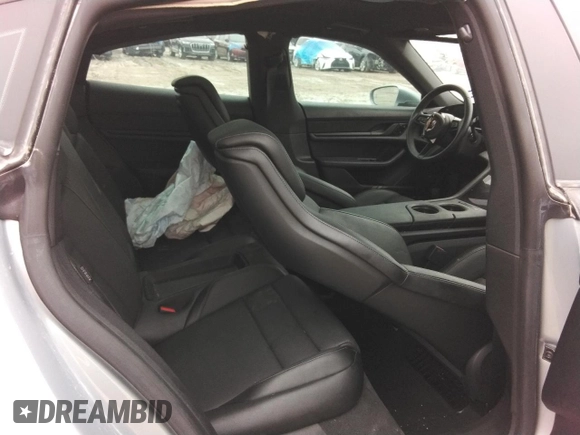 2021 Porsche Taycan z VIN WP0AA2Y14MSA18735, wystawiony jako Copart lot #72616054 z przebiegiem Nie podano mil oraz Szkoda całkowita • Salvage title. Historia ofert i sprzedaży dostępna na DreamBid. Obrazek 10.