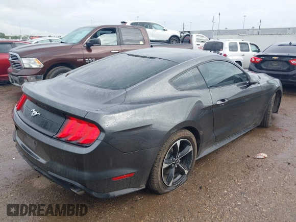 2018 Ford Mustang EcoBoost z VIN 1FA6P8TH2J5184485, wystawiony jako IAAI lot #41884810 z przebiegiem 74 999 mil mil oraz . Historia ofert i sprzedaży dostępna na DreamBid. Obrazek 4.