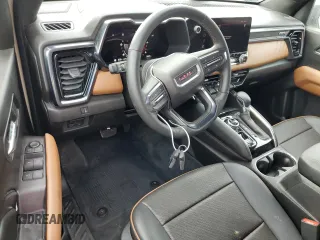 2023 GMC Canyon 4WD AT4 with VIN 1GTP6DEK3P1151112, listed as a Copart auction lot 77150454 with 5,573 mi miles and Non Repairable. Bid and sale history available at carsss.com. Image 8.