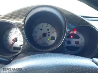 2003 Toyota MR2 Spyder with VIN JTDFR320130057360, listed as a IAAI auction lot 41696384 with 52,621 mi miles. Bid and sale history available at carsss.com. Image 7.