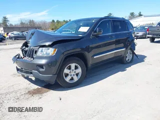 2011 Jeep Grand Cherokee Laredo z VIN 1J4RR4GG9BC519132, wystawiony jako IAAI lot #41931266 z przebiegiem 118 534 mil mil oraz . Historia ofert i sprzedaży dostępna na DreamBid. Obrazek 2.
