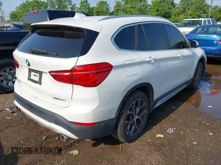 2021 BMW X1 xDrive28i with VIN WBXJG9C02M3M42379, listed as a IAAI auction lot 42476221 with 60,412 mi miles and . Bid and sale history available at DreamBid. Image 4.
