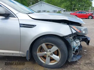 2015 Kia Optima LX z VIN 5XXGM4A70FG392359, wystawiony jako IAAI lot #42232025 z przebiegiem 192 636 mil mil oraz . Historia ofert i sprzedaży dostępna na DreamBid. Obrazek 19.