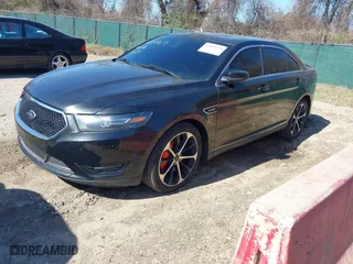 2014 Ford Taurus SHO with VIN 1FAHP2KT0EG164404, listed as a IAAI auction lot 41899695 with 157,077 mi miles. Bid and sale history available at carsss.com. Image 18.