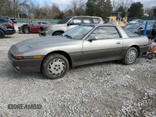 1986 Toyota Supra z VIN JT2MA70L3G0009411, wystawiony jako Copart lot #87545755 z przebiegiem 151 108 mil mil oraz Czysty tytuł • Clean title. Historia ofert i sprzedaży dostępna na DreamBid. Obrazek 1.