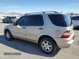 2004 Mercedes-Benz M-Class 5.0L with VIN 4JGAB75E64A488281, listed as a Copart auction lot 77031744 with 128,699 mi miles and Salvage Title. Bid and sale history available at carsss.com. Image 2.