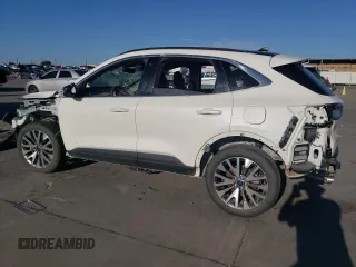 2022 Ford Escape Titanium z VIN 1FMCU9J91NUB93886, wystawiony jako Copart lot #69189524 z przebiegiem Nie podano mil oraz Czysty tytuł • Clean title. Historia ofert i sprzedaży dostępna na DreamBid. Obrazek 2.