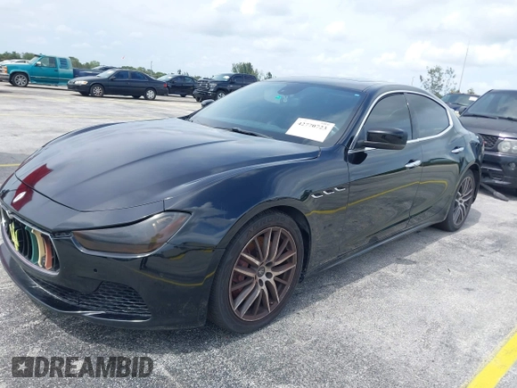 2015 Maserati Ghibli with VIN ZAM57XSA1F1144073, listed as a IAAI auction lot 42770723 with 105,782 mi miles and . Bid and sale history available at DreamBid. Image 2.
