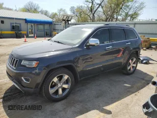 2014 Jeep Grand Cherokee Limited with VIN 1C4RJFBG4EC265947, listed as a Copart auction lot 52448155 with 127,700 mi miles and Salvage title. Bid and sale history available at DreamBid. Image 1.