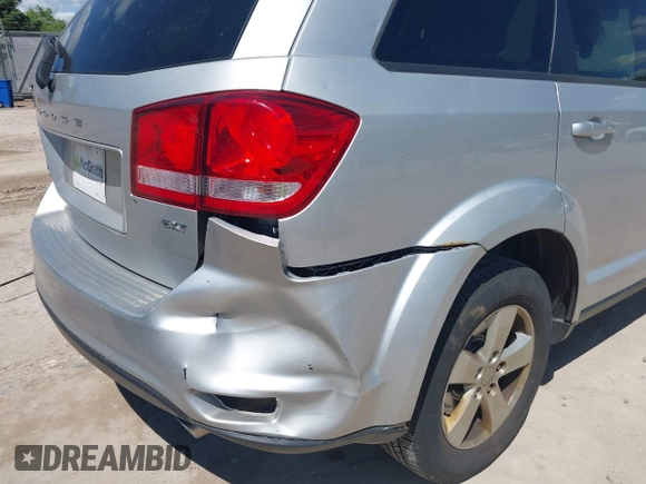 2012 Dodge Journey SXT z VIN 3C4PDCBGXCT390031, wystawiony jako IAAI lot #42281143 z przebiegiem 130 213 mil mil oraz . Historia ofert i sprzedaży dostępna na DreamBid. Obrazek 13.