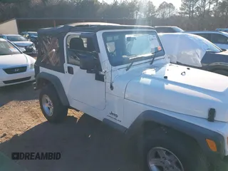 2004 Jeep Wrangler Sport Right Hand Drive with VIN 1J4F449S74P732854, listed as a IAAI auction lot 41408316 with 112,064 mi miles. Bid and sale history available at carsss.com. Image 6.