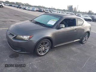 2012 Scion tC with VIN JTKJF5C74C3026945, listed as a IAAI auction lot 41757437 with 104,039 mi miles. Bid and sale history available at carsss.com. Image 2.