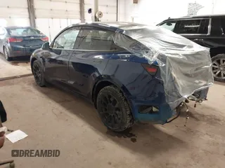 2021 Tesla Model Y Long Range with VIN 5YJYGDEE2MF185945, listed as a IAAI auction lot 41599029 with 53,815 mi miles and . Bid and sale history available at DreamBid. Image 3.