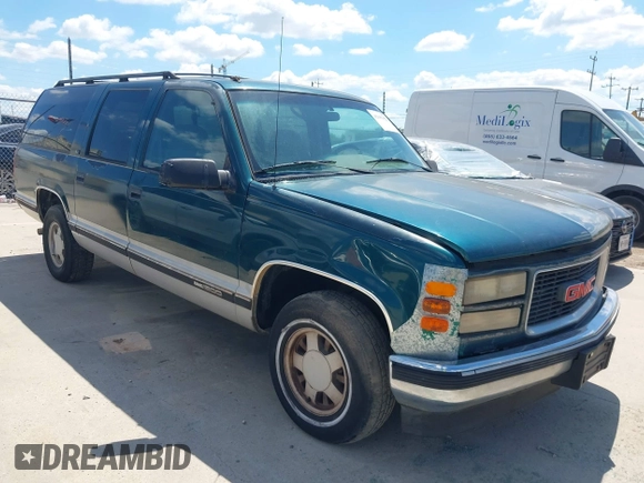 1995 GMC Suburban z VIN 1GKEC16KXSJ712111, wystawiony jako IAAI lot #42185423 z przebiegiem 269 010 mil mil oraz . Historia ofert i sprzedaży dostępna na DreamBid. Obrazek 1.