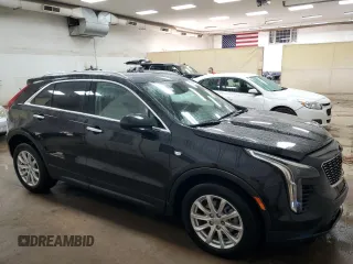 2022 Cadillac XT4 AWD Luxury with VIN 1GYFZBR45NF145986, listed as a Copart auction lot 79198274 with 23,477 mi miles and Salvage Title. Bid and sale history available at carsss.com. Image 4.