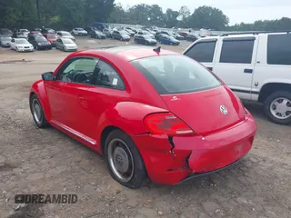 2012 Volkswagen Beetle 2.5L PZEV with VIN 3VWJP7AT2CM665045, listed as a IAAI auction lot 40222839 with 114,624 mi miles. Bid and sale history available at carsss.com. Image 3.