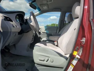 2012 Toyota Sienna LE AAS with VIN 5TDKK3DC7CS195590, listed as a Copart auction lot 57968415 with 201,732 mi miles and Salvage title. Bid and sale history available at DreamBid. Image 7.