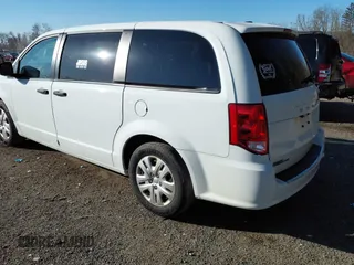2019 Dodge Grand Caravan SE with VIN 2C4RDGBG2KR799660, listed as a IAAI auction lot 41898556 with 104,642 mi miles and . Bid and sale history available at DreamBid. Image 3.