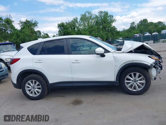 2014 Mazda CX-5 Touring z VIN JM3KE4CY9E0373359, wystawiony jako IAAI lot #42209277 z przebiegiem 106 493 mil mil oraz . Historia ofert i sprzedaży dostępna na DreamBid. Obrazek 14.