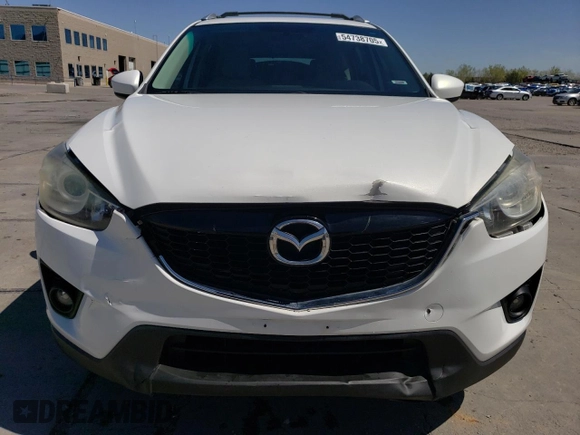 2014 Mazda CX-5 Touring z VIN JM3KE4CYXE0393443, wystawiony jako Copart lot #54738705 z przebiegiem 68 220 mil mil oraz Szkody całkowita. Historia ofert i sprzedaży dostępna na DreamBid. Obrazek 5.