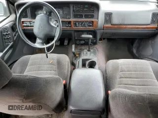 1996 Jeep Grand Cherokee Laredo with VIN 1J4GZ58S7TC403946, listed as a Copart auction lot 71785734 with 231,780 mi miles and Salvage Title. Bid and sale history available at carsss.com. Image 8.