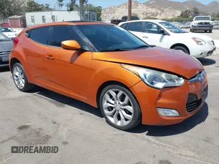 2012 Hyundai Veloster w/Gray Int z VIN KMHTC6ADXCU037879, wystawiony jako IAAI lot #42093850 z przebiegiem 189 991 mil mil oraz . Historia ofert i sprzedaży dostępna na DreamBid. Obrazek 1.