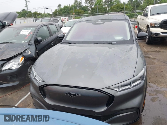 2021 Ford Mustang Mach-E Premium z VIN 3FMTK3R74MMA27709, wystawiony jako IAAI lot #42102335 z przebiegiem 54 988 mil mil oraz . Historia ofert i sprzedaży dostępna na DreamBid. Obrazek 13.